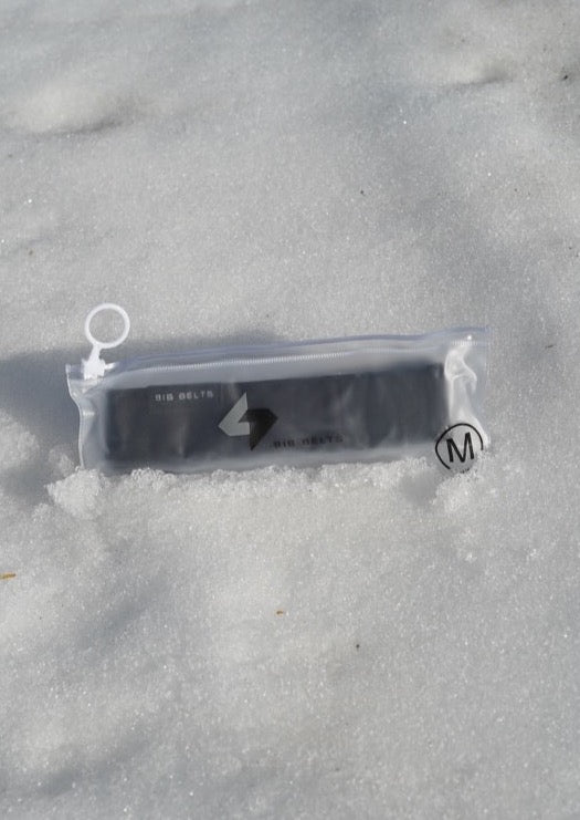 size medium black bib belt in the snow