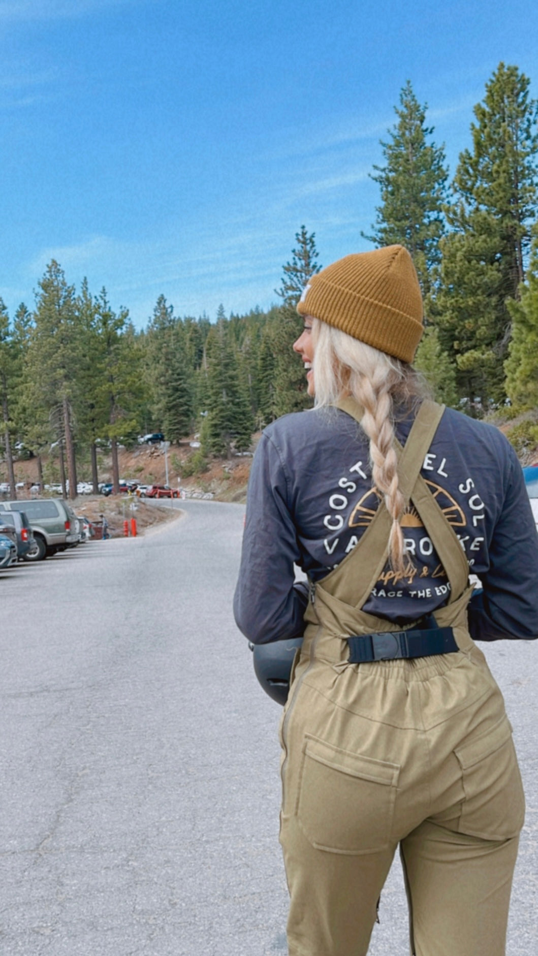 Snowboard girl walking to ride at mountain in california