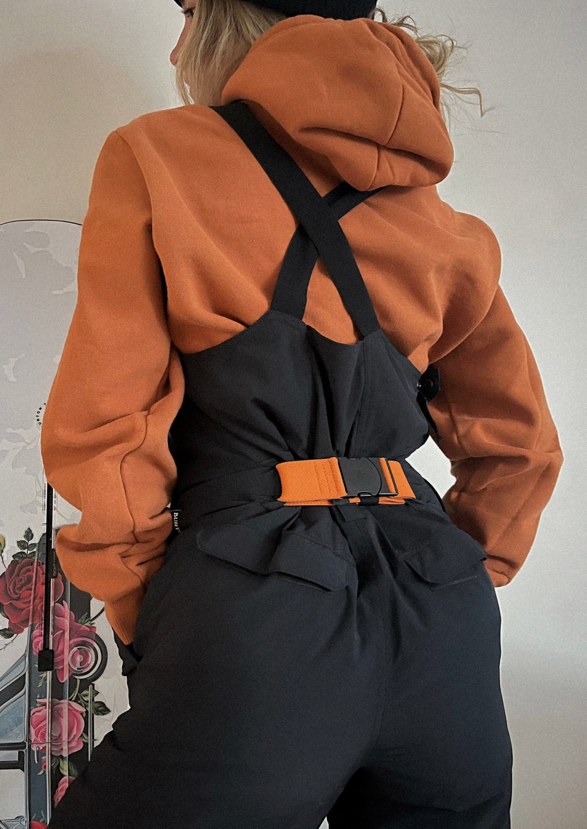 Orange Elastic Bib belt on girl wearing snowboard bibs